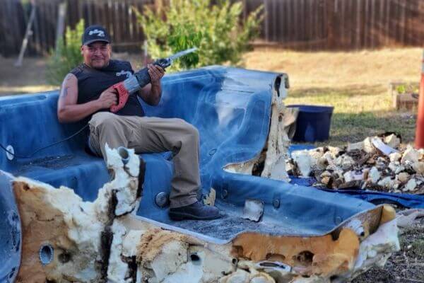 Worker removing outdated bathtub junk removal oakland ca